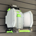 EGO LT1000 area light hanging by its handle on a PartForge slatwall mount