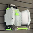 EGO LT1000 area light hanging by its handle on a PartForge slatwall mount