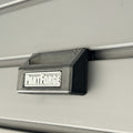 PartForge mounting bracket for EGO mower bags installed on a Gladiator GearWall panel.